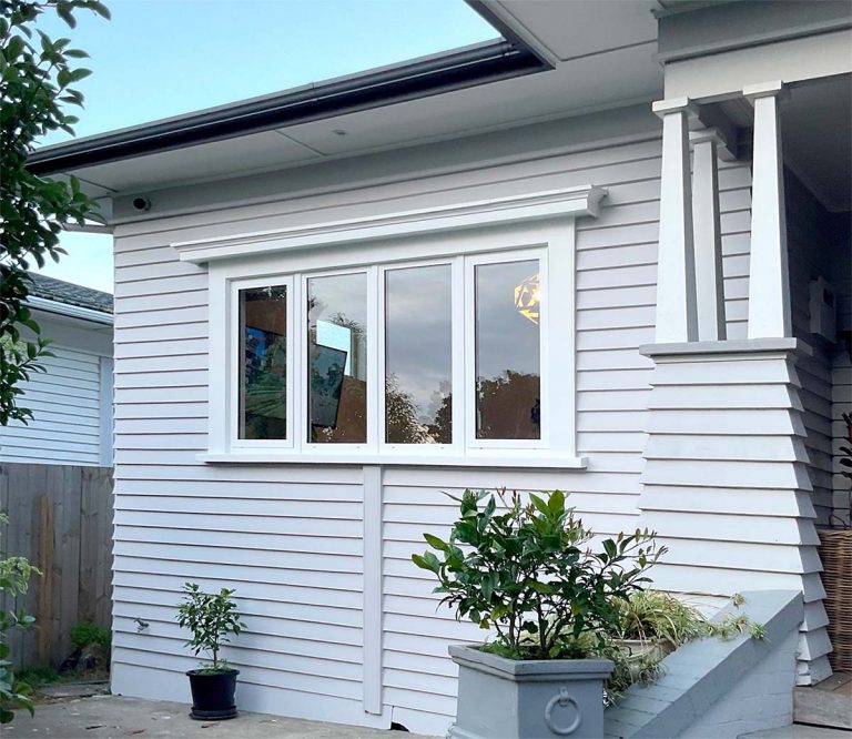 Heritage Auckland villa with modern aluminium window inserts maintaining traditional character